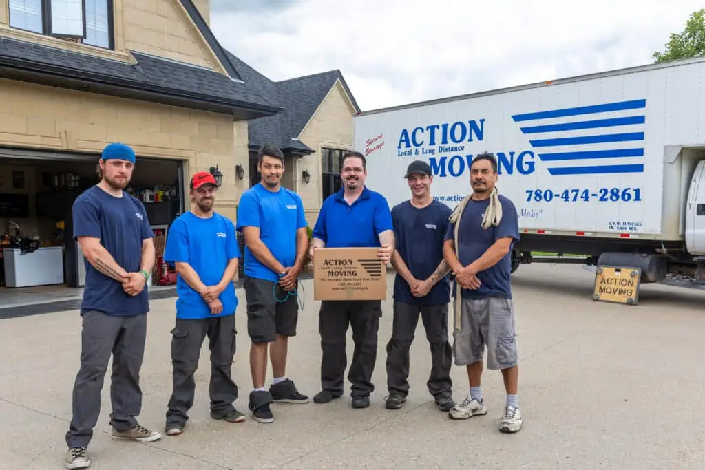 Action Moving Men Standing in front of an Action Moving Truck