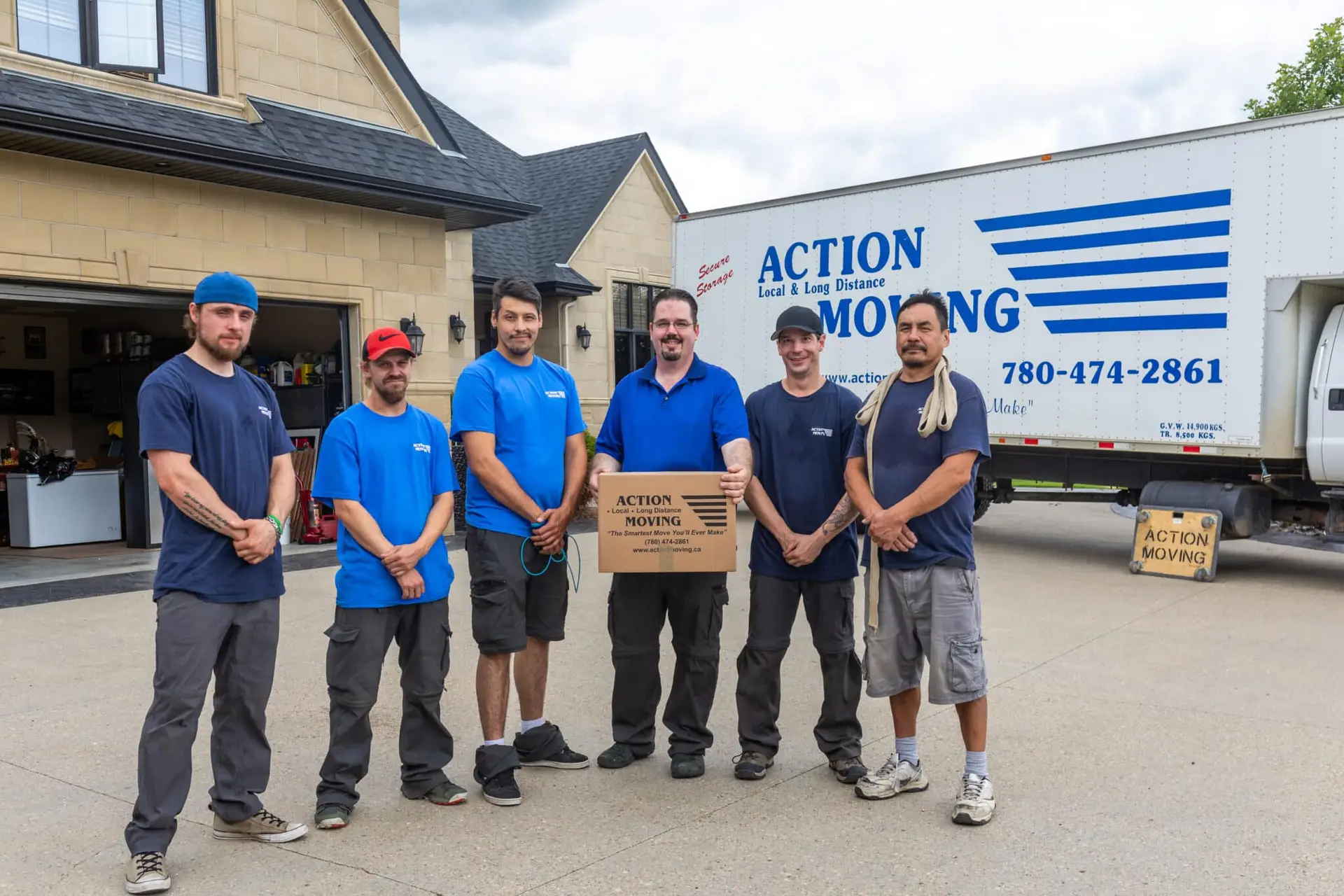 Action Moving Men Standing in front of an Action Moving Truck
