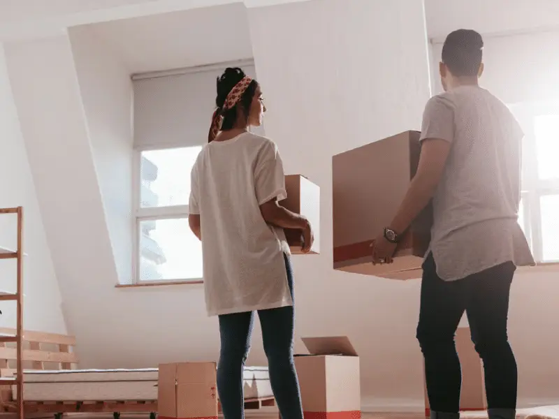 People moving into their home with moving boxes