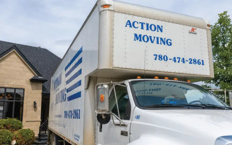Action Moving truck parked outside house